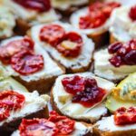 Goat Cheese Crostini: The EASY & DELICIOUS party appetizer that looks fancy AF. Tons of topping ideas & tips for a crowd-pleasing spread. Your friends will be begging for the recipe! (Focus keyword bolded, highlights ease, deliciousness, and crowd-pleasing aspect)