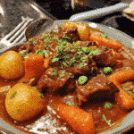 Season beef chunks with salt and pepper, Heat oil in a large skillet over medium-high heat, Brown beef in batches until seared on all sides, Transfer beef to slow cooker, Add chopped onions to the same skillet and sauté until translucent, Add minced garlic and cook for 30 seconds until fragrant, Deglaze skillet with red wine or beef broth, scraping up browned bits, Pour liquid mixture into slow cooker, Add chopped carrots, celery, and potatoes to slow cooker, Add bay leaves, thyme, rosemary, and other desired herbs, Pour in beef broth until ingredients are mostly covered, Stir in tomato paste, Worcestershire sauce, and any other desired seasonings, Cover slow cooker and cook on low for 7-8 hours or high for 4-5 hours until beef is tender, In a small bowl, mix flour with water to create a slurry, Stir slurry into stew during last 30 minutes of cooking to thicken, Remove bay leaves and herb stems before serving, Taste and adjust seasonings if needed, Serve hot with crusty bread